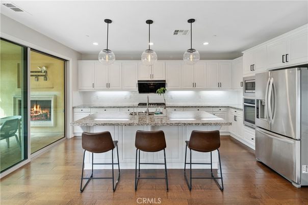 Fireplace, Interior, Kitchen, Pendant Lights, Recessed Lighting, Stainless Steel Appliances, Wood Texture Flooring