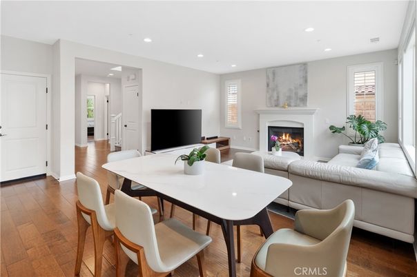 Dining room, Fireplace, Interior, Living room, Recessed Lighting, Wood Texture Flooring