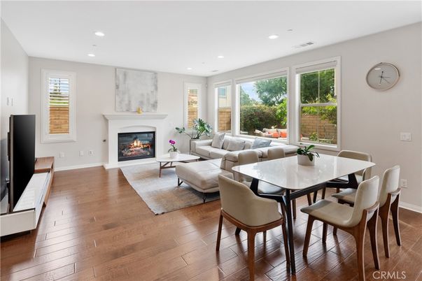 Dining room, Fireplace, Interior, Living room, Recessed Lighting, Wood Texture Flooring
