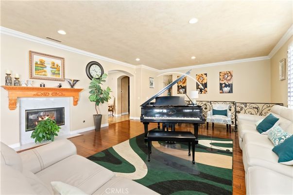 Fireplace, Interior, Living room, Piano, Recessed Lighting, Wood Texture Flooring