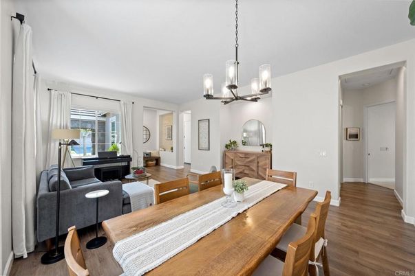 Chandelier, Dining room, Fireplace, Interior, Living room, Pendant Lights, Wood Texture Flooring