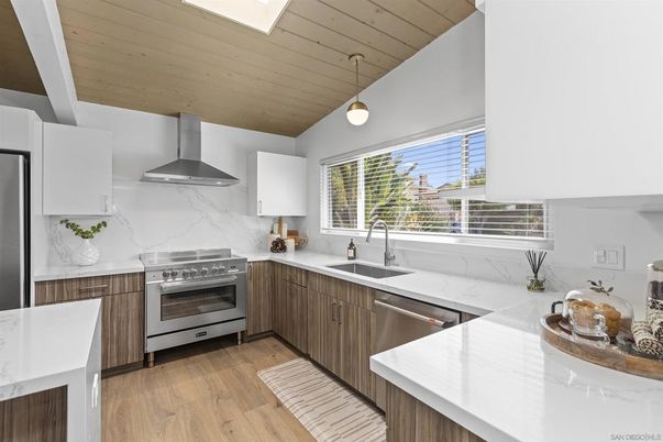 Interior, Kitchen, Marble Walls, Pendant Lights, Stainless Steel Appliances, Wood Texture Flooring