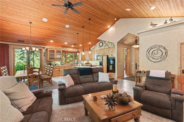 Chandelier, Dining room, Interior, Kitchen, Living room, Pendant Lights, Recessed Lighting, Stainless Steel Appliances, Wooden Ceilings