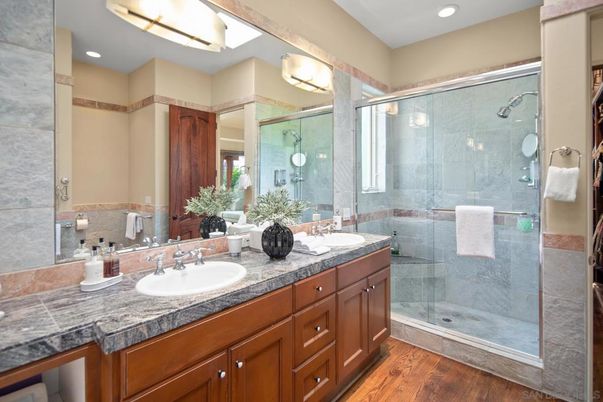 Bathroom, Dual Sink Vanities, Glass Shower, Interior, Recessed Lighting, Wood Texture Flooring
