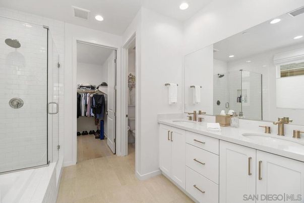 Bathroom, Dual Sink Vanities, Glass Shower, Interior, Recessed Lighting, Walk-in Closets, Wood Texture Flooring