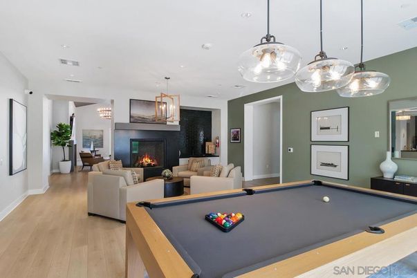 Billiard Table, Fireplace, Game Room, Interior, Living room, Pendant Lights, Recessed Lighting, Wood Texture Flooring