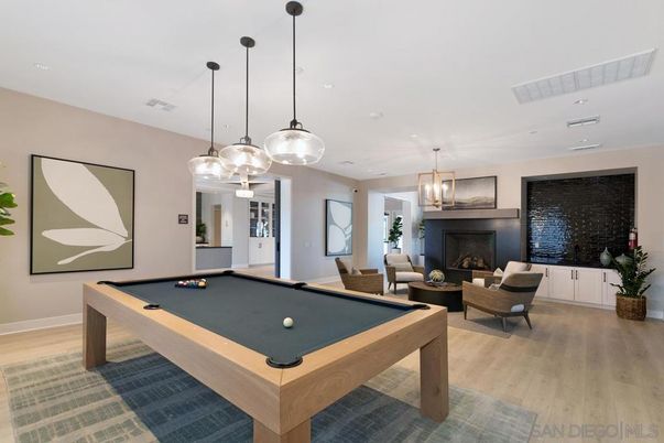 Billiard Table, Fireplace, Game Room, Interior, Living room, Pendant Lights, Recessed Lighting, Wood Texture Flooring