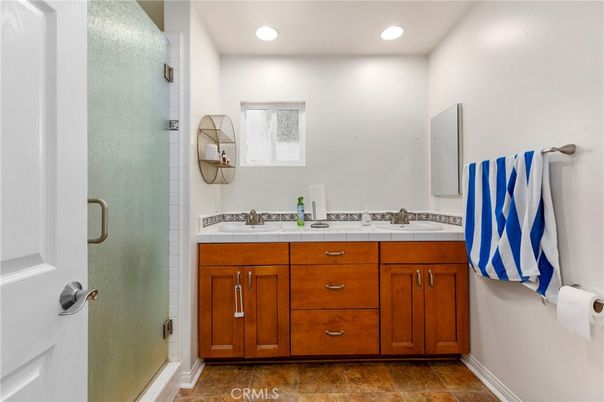 Bathroom, Dual Sink Vanities, Glass Shower, Interior, Recessed Lighting, Tile Countertops