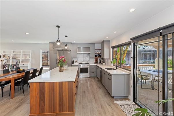 Dining room, Interior, Kitchen, Pendant Lights, Recessed Lighting, Stainless Steel Appliances, Wood Texture Flooring