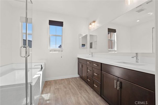 Bathroom, Dual Sink Vanities, Glass Shower, Interior, Recessed Lighting, Wood Texture Flooring