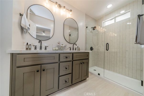Bathroom, Dual Sink Vanities, Glass Shower, Interior, Recessed Lighting, Wood Texture Flooring