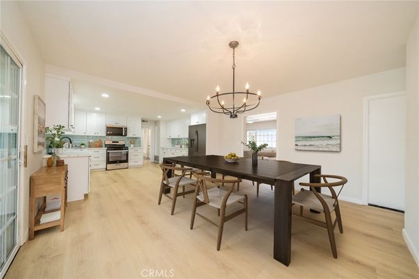 Chandelier, Dining room, Interior, Kitchen, Recessed Lighting, Stainless Steel Appliances, Wood Texture Flooring