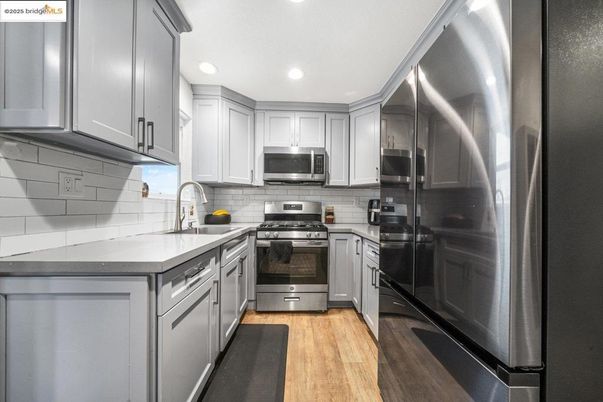 Interior, Kitchen, Recessed Lighting, Stainless Steel Appliances, Wood Texture Flooring