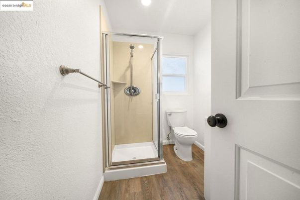 Bathroom, Glass Shower, Interior, Recessed Lighting, Wood Texture Flooring