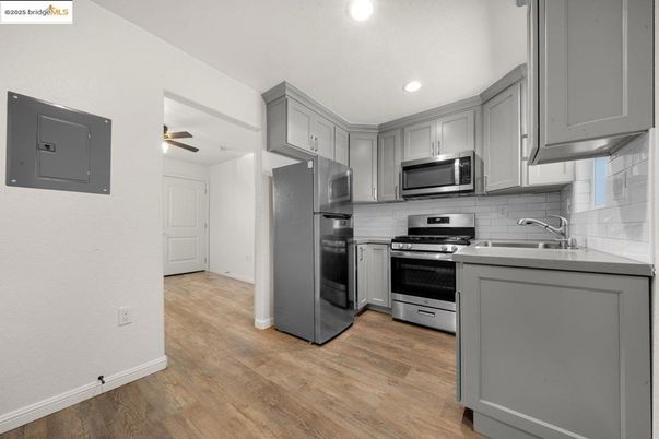 Interior, Kitchen, Recessed Lighting, Stainless Steel Appliances, Wood Texture Flooring