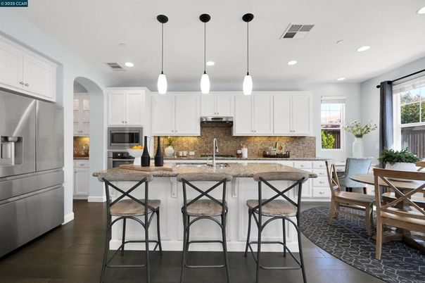 Dining room, Interior, Kitchen, Pendant Lights, Recessed Lighting, Stainless Steel Appliances, Wood Texture Flooring