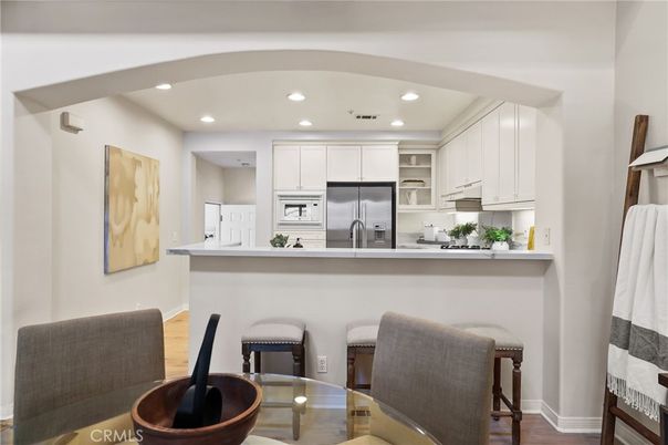 Dining room, Interior, Kitchen, Recessed Lighting, Stainless Steel Appliances, Wood Texture Flooring