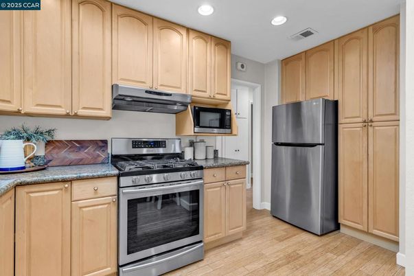 Interior, Kitchen, Recessed Lighting, Stainless Steel Appliances, Wood Texture Flooring