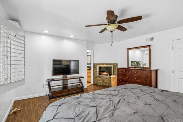 Bedroom, Fireplace, Interior, Recessed Lighting, Wood Texture Flooring