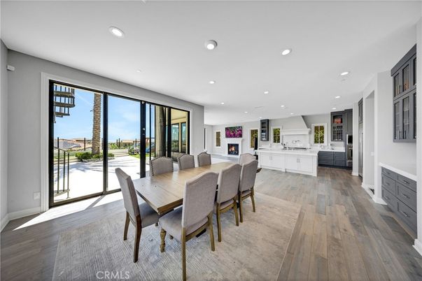Dining room, Fireplace, Interior, Kitchen, Recessed Lighting, Wood Texture Flooring