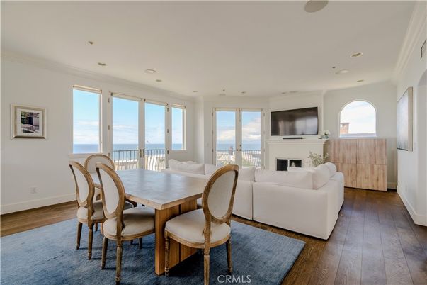 Dining room, Fireplace, Interior, Living room, Recessed Lighting, Water, Wood Texture Flooring