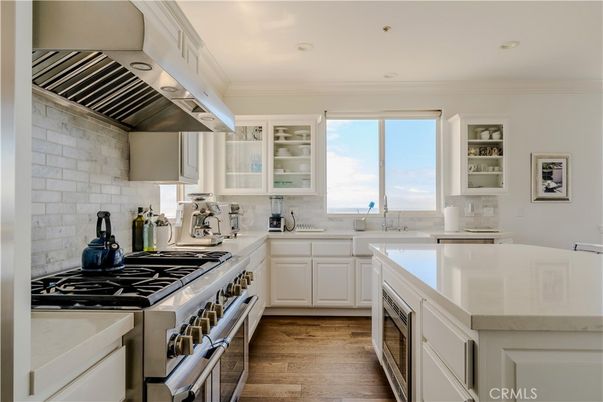Interior, Kitchen, Recessed Lighting, Stainless Steel Appliances, Stone Walls, Water, Wood Texture Flooring