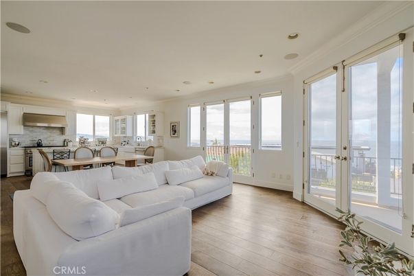 Dining room, Interior, Kitchen, Living room, Recessed Lighting, Water, Wood Texture Flooring