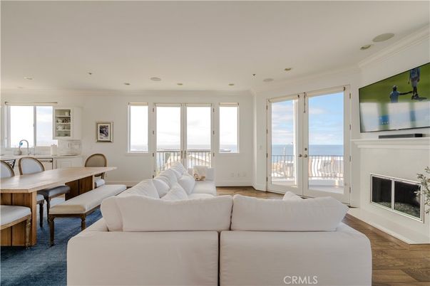 Dining room, Fireplace, Interior, Living room, Recessed Lighting, Water, Wood Texture Flooring
