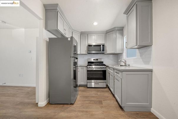 Interior, Kitchen, Recessed Lighting, Stainless Steel Appliances, Wood Texture Flooring