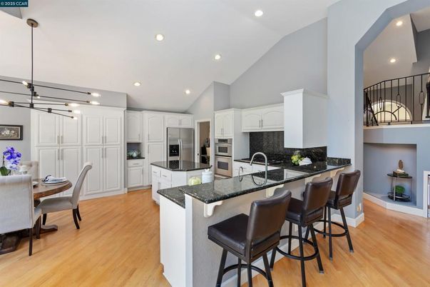 Dining room, Interior, Kitchen, Pendant Lights, Recessed Lighting, Stainless Steel Appliances, Wood Texture Flooring