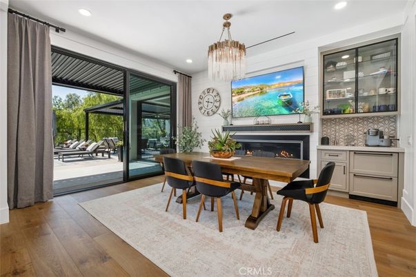 Chandelier, Dining room, Fireplace, Interior, Recessed Lighting, Wood Texture Flooring