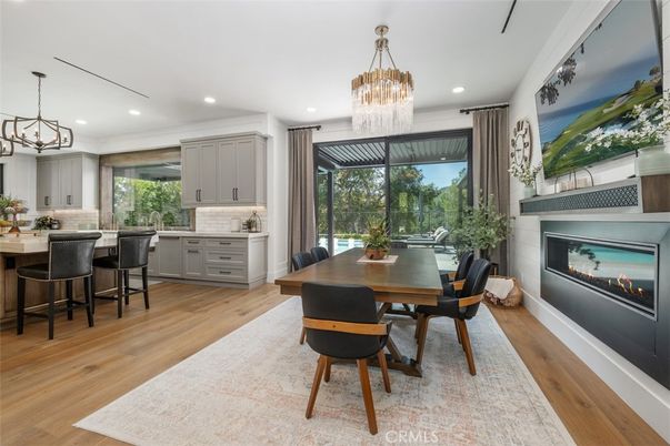 Chandelier, Dining room, Fireplace, Interior, Pendant Lights, Recessed Lighting, Wood Texture Flooring