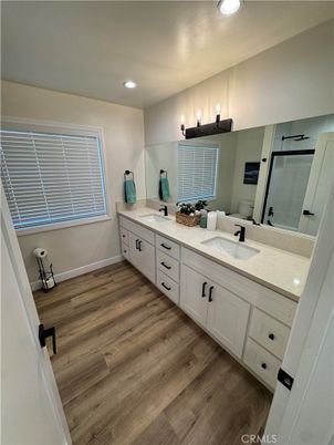 Bathroom, Dual Sink Vanities, Interior, Recessed Lighting, Wood Texture Flooring