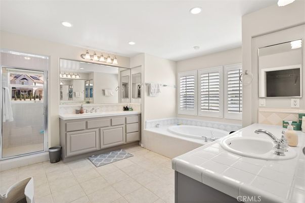 Bathroom, Dual Sink Vanities, Glass Shower, Interior, Recessed Lighting, Tile Countertops