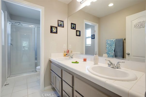 Bathroom, Dual Sink Vanities, Glass Shower, Interior, Recessed Lighting, Tile Countertops