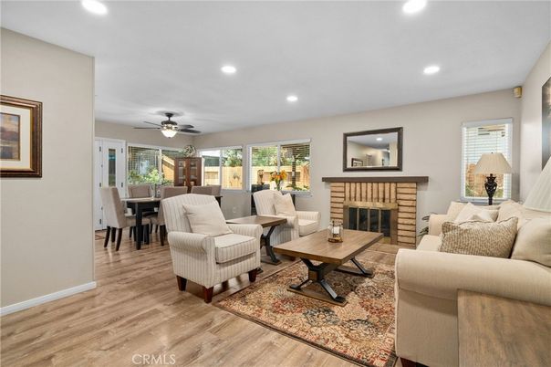 Dining room, Fireplace, Interior, Living room, Recessed Lighting, Wood Texture Flooring