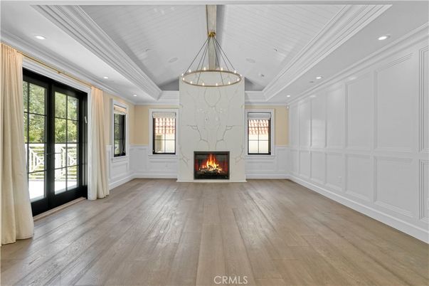 Chandelier, Empty room, Fireplace, Interior, Pendant Lights, Recessed Lighting, Wood Texture Flooring