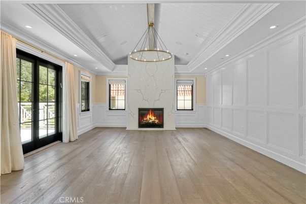 Chandelier, Empty room, Fireplace, Interior, Pendant Lights, Recessed Lighting, Wood Texture Flooring