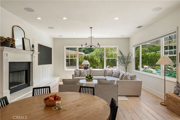 Dining room, Fireplace, Interior, Living room, Pendant Lights, Recessed Lighting, Wood Texture Flooring