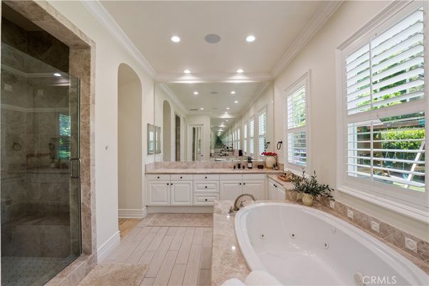 Bathroom, Dual Sink Vanities, Glass Shower, Interior, Recessed Lighting, Wood Texture Flooring