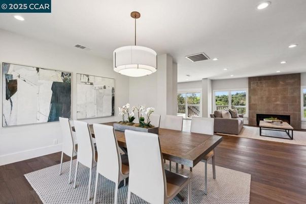 Dining room, Fireplace, Interior, Living room, Pendant Lights, Recessed Lighting, Wood Texture Flooring