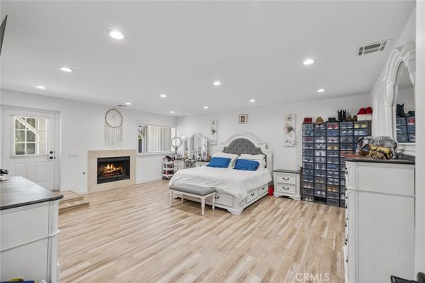 Bedroom, Fireplace, Interior, Recessed Lighting, Wood Texture Flooring