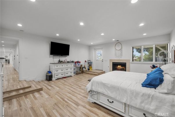 Bedroom, Fireplace, Interior, Recessed Lighting, Wood Texture Flooring