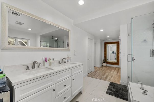 Bathroom, Dual Sink Vanities, Glass Shower, Interior, Recessed Lighting, Wood Texture Flooring