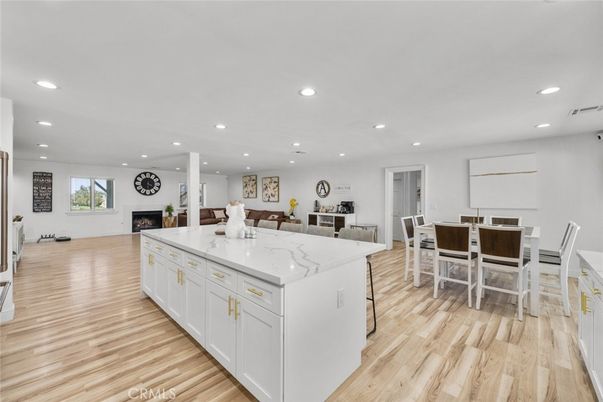 Dining room, Fireplace, Interior, Kitchen, Recessed Lighting, Wood Texture Flooring