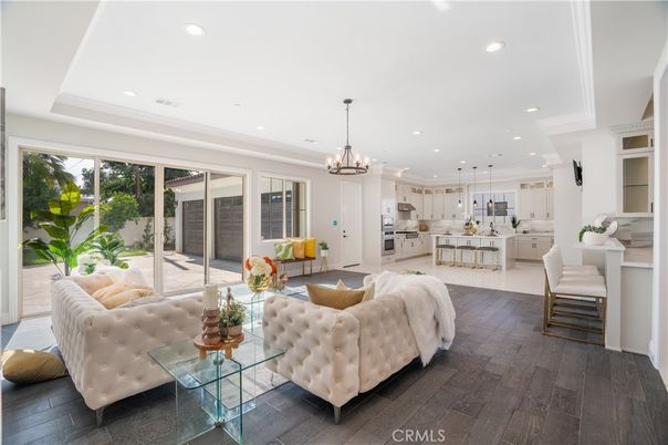 Chandelier, Interior, Kitchen, Living room, Pendant Lights, Recessed Lighting, Stainless Steel Appliances, Wood Texture Flooring