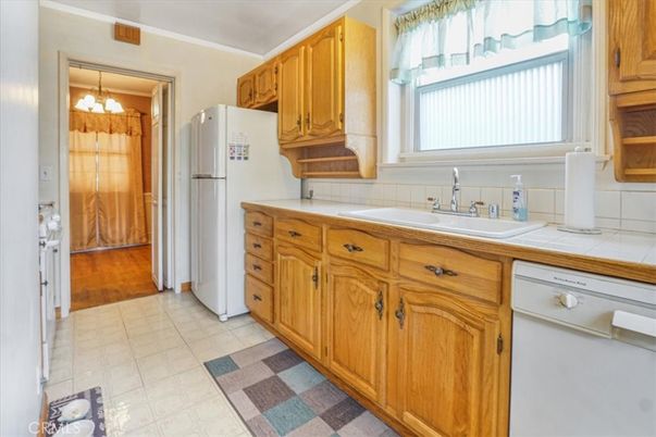 Interior, Kitchen, Pendant Lights, Tile Countertops, Wood Texture Flooring
