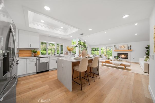 Fireplace, Interior, Kitchen, Living room, Recessed Lighting, Stainless Steel Appliances, Wood Texture Flooring