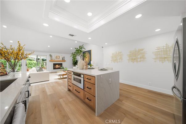 Fireplace, Interior, Kitchen, Living room, Recessed Lighting, Wood Texture Flooring