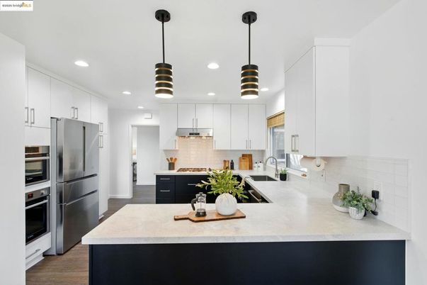 Interior, Kitchen, Pendant Lights, Recessed Lighting, Stainless Steel Appliances, Wood Texture Flooring